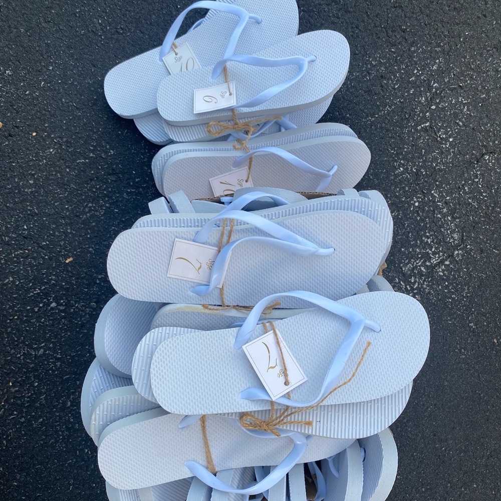 About 20 misc sized white sandals. Can be used for dance floor for wedding